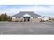 Community clubhouse building with a bicycle rack and parking spaces in front at 7354 Ponderosa Pines Ln, Indianapolis, IN 46239