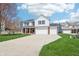 Beautiful home with a large driveway, well-kept lawn and a charming two-story facade at 7354 Ponderosa Pines Ln, Indianapolis, IN 46239