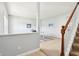 Bright landing area leads to a home office with a stairway and view of the office at 7354 Ponderosa Pines Ln, Indianapolis, IN 46239