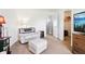 Comfortable living room with a sofa, ottoman, and a doorway to a closet at 7354 Ponderosa Pines Ln, Indianapolis, IN 46239