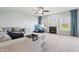 Spacious living room with a comfortable sectional couch, fireplace, and plenty of natural light at 7354 Ponderosa Pines Ln, Indianapolis, IN 46239