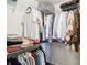 Walk-in closet with clothing rod and shelf provides ample storage for clothes, sweaters, and bags at 7354 Ponderosa Pines Ln, Indianapolis, IN 46239
