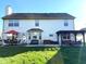 Spacious backyard featuring a patio with outdoor dining and seating areas, perfect for entertaining at 7354 Samuel Dr, Indianapolis, IN 46259