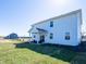 Spacious backyard with a covered patio, perfect for outdoor relaxation and entertaining guests at 7628 Big Bend Blvd, Camby, IN 46113