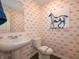 Stylish half bathroom with unique wallpaper and modern fixtures at 7628 Big Bend Blvd, Camby, IN 46113