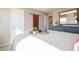 Bright bedroom showcasing a dresser, sliding barn door, and a well-lit, comfortable space at 7628 Big Bend Blvd, Camby, IN 46113