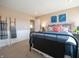 Inviting bedroom features stylish decor, cozy bedding, decorative ladder and an adjacent bathroom at 7628 Big Bend Blvd, Camby, IN 46113