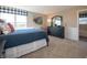 Comfortable bedroom with large window, decorative pillows and dark wood dresser at 7628 Big Bend Blvd, Camby, IN 46113