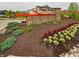 Community entrance sign with colorful flowerbeds and stone accents at 7628 Big Bend Blvd, Camby, IN 46113