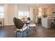 Bright dining area with round table, four chairs, and sliding glass doors that fill the space with natural light at 7628 Big Bend Blvd, Camby, IN 46113