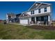 A two-story home featuring a brick facade, attached two car garage, and covered porch at 7628 Big Bend Blvd, Camby, IN 46113
