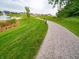 Scenic community walking path winding along a pond at 7628 Big Bend Blvd, Camby, IN 46113
