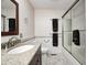 Bathroom featuring granite countertops and a tiled shower at 7688 Gunsmith Ct, Plainfield, IN 46168