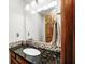 Bathroom boasts granite counters, mosaic tile backsplash, and a modern sink and faucet at 7688 Gunsmith Ct, Plainfield, IN 46168