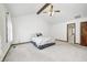 Bright bedroom features vaulted ceiling, wooden beams, and an ensuite bathroom entrance at 7688 Gunsmith Ct, Plainfield, IN 46168