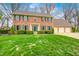 Charming brick home with manicured lawn, mature landscaping, and a three-car garage at 7688 Gunsmith Ct, Plainfield, IN 46168