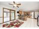 Eat-in kitchen featuring wood cabinets, granite counters, stainless steel appliances, and an adjacent dining area at 7688 Gunsmith Ct, Plainfield, IN 46168