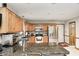 Well-lit kitchen featuring wood cabinets, granite countertops, and stainless steel appliances at 7688 Gunsmith Ct, Plainfield, IN 46168