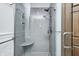 Modern shower featuring a built-in seat, updated fixtures, and a sleek glass enclosure at 7688 Gunsmith Ct, Plainfield, IN 46168