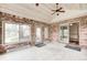 The sunroom features brick walls, tile flooring, and multiple access points at 7688 Gunsmith Ct, Plainfield, IN 46168