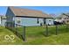 Fenced backyard with a well-manicured lawn at 8019 Gathering Ln, Indianapolis, IN 46259