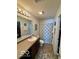 Bright bathroom with a walk-in shower, modern lighting, and vanity at 8019 Gathering Ln, Indianapolis, IN 46259