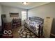 Bedroom with a single bed, wooden floors, gray walls and a dresser at 8019 Gathering Ln, Indianapolis, IN 46259