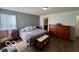 Comfortable bedroom showcasing natural light and warm gray wall tones at 8019 Gathering Ln, Indianapolis, IN 46259