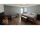 Spacious bedroom with neutral walls and floors, and comfortable furniture at 8019 Gathering Ln, Indianapolis, IN 46259