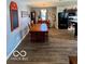 Inviting dining room area with a long wooden table and natural light at 8019 Gathering Ln, Indianapolis, IN 46259