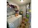 The laundry room has a washing machine, dryer, shelving, and a water heater at 8019 Gathering Ln, Indianapolis, IN 46259