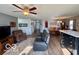 Comfortable living room featuring a ceiling fan, wood floors and a cozy chair at 8019 Gathering Ln, Indianapolis, IN 46259