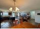 Open-concept living space seamlessly blends the kitchen, dining, and living areas at 8019 Gathering Ln, Indianapolis, IN 46259