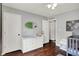 Functional bedroom design with a changing table, closet, and neutral walls for a calm space at 902 Helm Dr, Avon, IN 46123