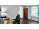 Well-lit bedroom with modern chair, sleek desk, and hardwood floors, perfect for an office space at 902 Helm Dr, Avon, IN 46123