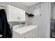 Well-equipped laundry room featuring modern white appliances and convenient cabinet storage at 902 Helm Dr, Avon, IN 46123