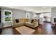 Bright living room with hardwood floors, comfortable seating, and open access to the kitchen at 902 Helm Dr, Avon, IN 46123