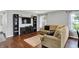 Spacious living room featuring hardwood floors, modern shelving, and a relaxing atmosphere at 902 Helm Dr, Avon, IN 46123