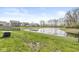 Spacious backyard with a serene pond and neighborhood views at 9157 Tansel Crk Dr, Indianapolis, IN 46234