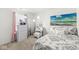 Well lit bedroom with updated furnishings, decorative wall art, and a large window at 9157 Tansel Crk Dr, Indianapolis, IN 46234