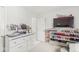 Bedroom with shelves for shoes and TV; featuring a white dresser and ample storage at 9157 Tansel Crk Dr, Indianapolis, IN 46234