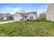 Attractive single-story home with a well-kept lawn and attached two-car garage at 9157 Tansel Crk Dr, Indianapolis, IN 46234