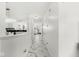 A bright, modern hallway leading to living spaces, enhanced by marble flooring and contemporary lighting at 9157 Tansel Crk Dr, Indianapolis, IN 46234