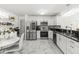 Modern kitchen with stainless steel appliances, white cabinets and granite counter tops at 9157 Tansel Crk Dr, Indianapolis, IN 46234