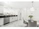 Bright kitchen featuring stainless steel appliances and an adjacent dining area at 9157 Tansel Crk Dr, Indianapolis, IN 46234