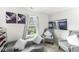 Bright living room with modern decor, comfortable seating, and view to the backyard at 9157 Tansel Crk Dr, Indianapolis, IN 46234