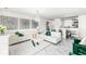 Bright living room features modern decor, stylish white marble floors, and an open floor plan leading to the dining area at 9157 Tansel Crk Dr, Indianapolis, IN 46234