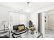 Bright living room with marble floors, modern lighting, and a black and white leather couch at 9157 Tansel Crk Dr, Indianapolis, IN 46234