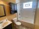 Functional bathroom with vanity, toilet, cabinet, and combined shower and tub at 9169 Hibben Ave, Indianapolis, IN 46229