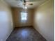 Bright bedroom featuring a ceiling fan and window offering natural light at 9169 Hibben Ave, Indianapolis, IN 46229